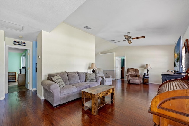 living room featuring dark hardwood / wood-style flooring, ceiling fan, and lofted ceiling