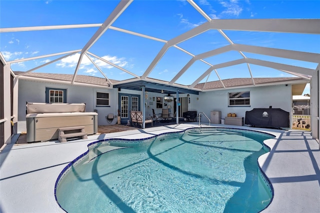 view of pool featuring french doors, glass enclosure, and a patio area