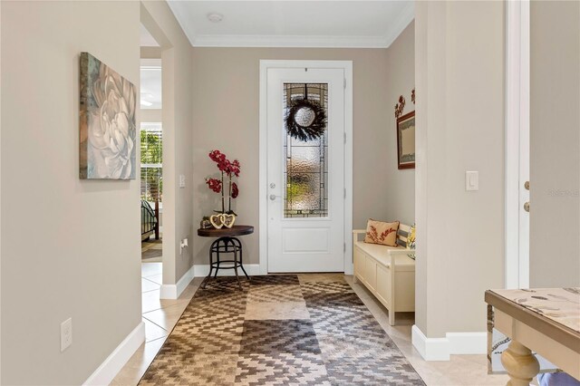 entryway featuring ornamental molding and light tile patterned floors