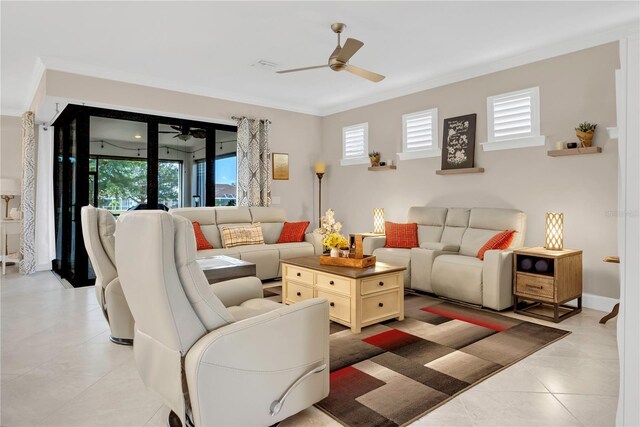 tiled living room featuring ceiling fan and ornamental molding