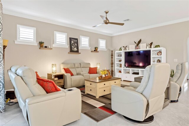 tiled living room with ceiling fan and ornamental molding