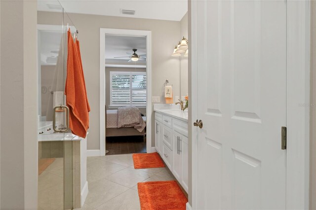 bathroom with vanity, a shower with curtain, ceiling fan, and tile patterned floors