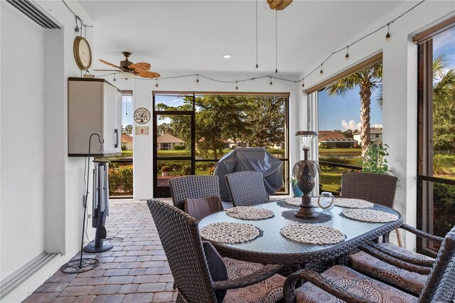 sunroom / solarium with ceiling fan