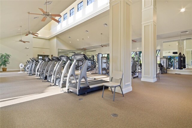 workout area with light colored carpet, ceiling fan, and high vaulted ceiling