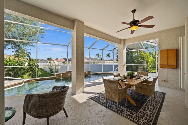 sunroom / solarium with a swimming pool and ceiling fan