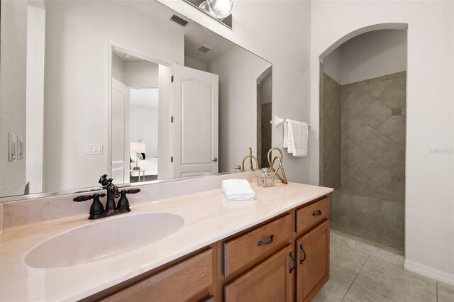 bathroom with tile patterned flooring and vanity