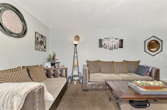 living room featuring a textured ceiling and dark carpet