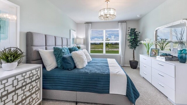 bedroom featuring light carpet and a notable chandelier