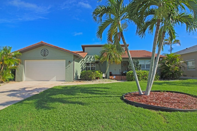 single story home featuring a garage and a front yard