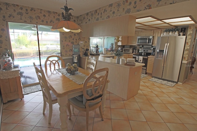 dining area with light tile patterned floors