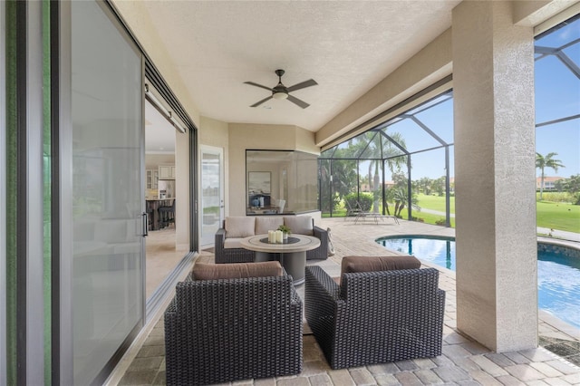 view of patio with a lanai and ceiling fan