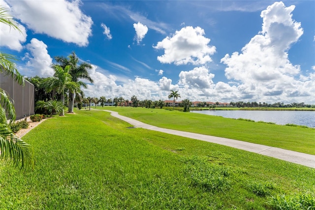 view of home's community featuring a water view and a yard