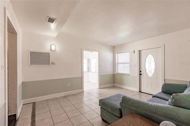 foyer entrance featuring light tile patterned floors