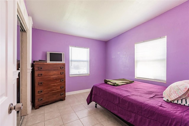 bedroom featuring light tile patterned floors