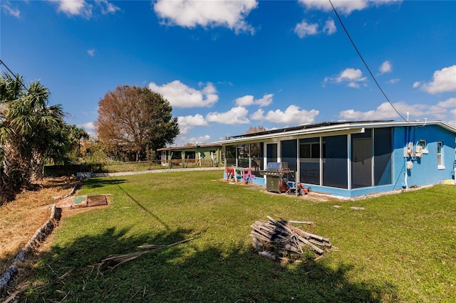 view of yard featuring a sunroom