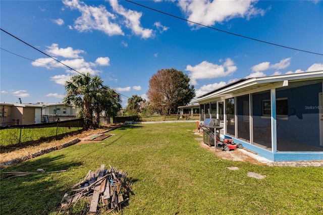 view of yard featuring a sunroom