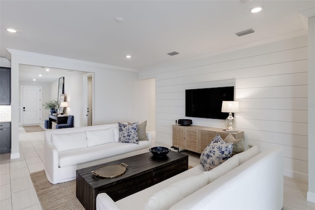 tiled living room featuring ornamental molding