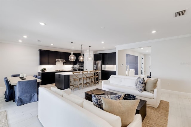 tiled living room featuring crown molding