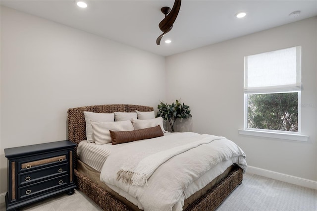 bedroom featuring light colored carpet