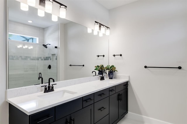 bathroom with a shower with door and vanity