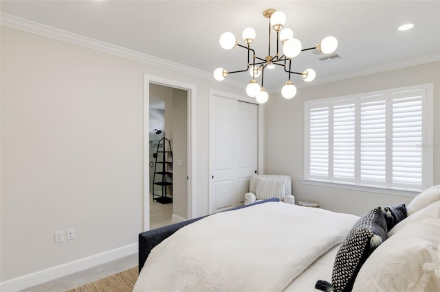 carpeted bedroom with ornamental molding, a notable chandelier, and a closet