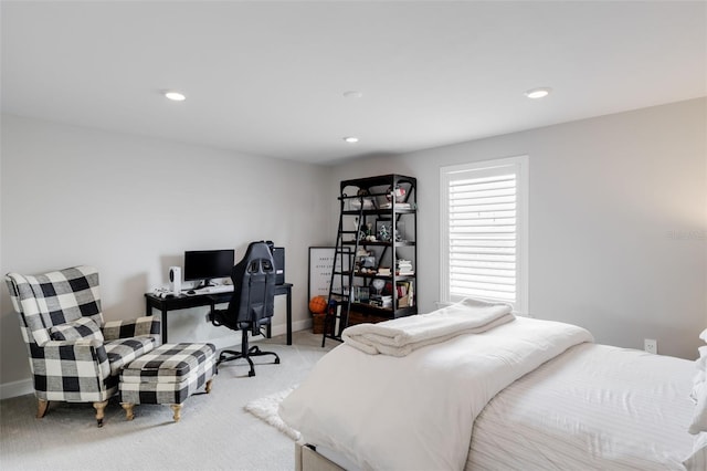 bedroom featuring light carpet