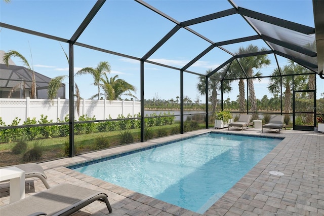 view of pool featuring a patio area and a lanai