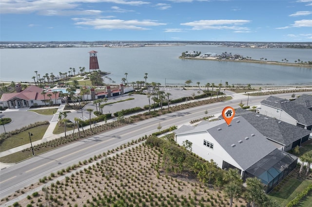 birds eye view of property with a water view