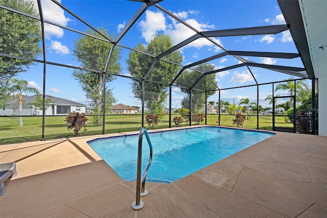 view of swimming pool with a lanai, a lawn, and a patio