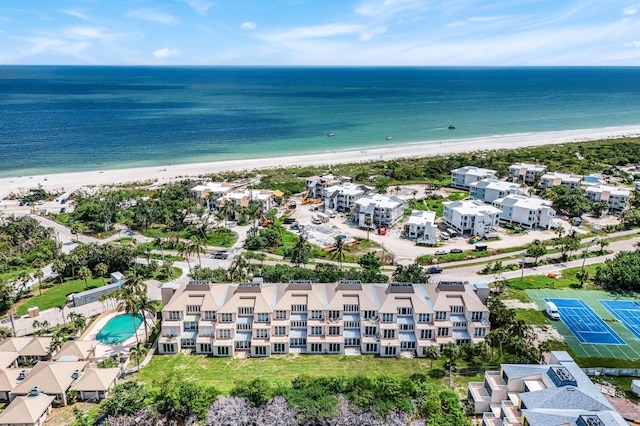 aerial view featuring a water view and a beach view