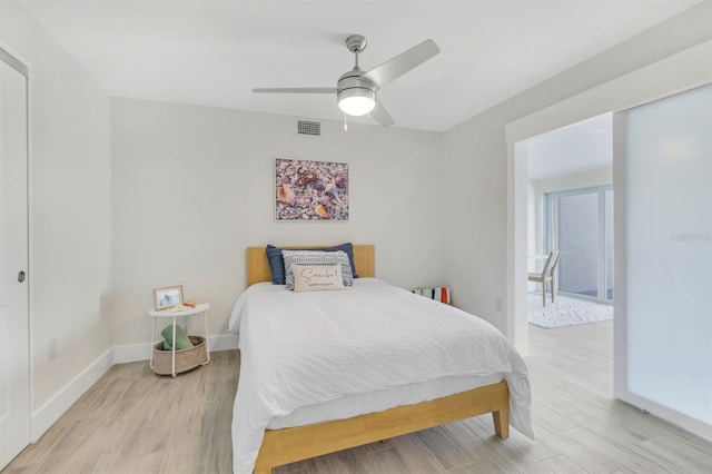 bedroom featuring light hardwood / wood-style flooring and ceiling fan