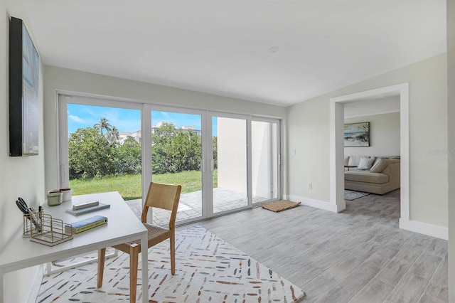 office with light hardwood / wood-style floors