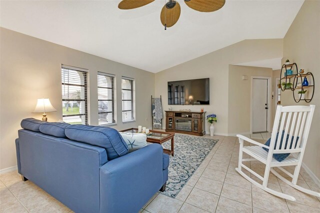 tiled living room featuring vaulted ceiling and ceiling fan