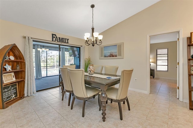 tiled dining space featuring a wealth of natural light, vaulted ceiling, and an inviting chandelier