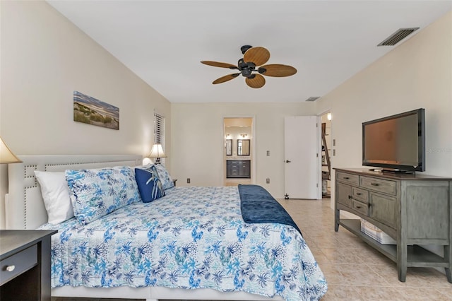 bedroom featuring ceiling fan, light tile patterned floors, and connected bathroom