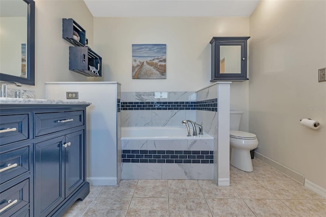 bathroom with vanity, toilet, a relaxing tiled tub, and tile patterned flooring