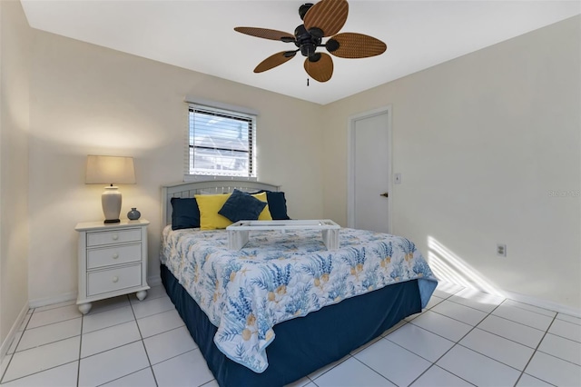 bedroom featuring light tile patterned floors and ceiling fan