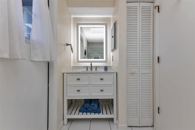 bathroom with vanity and tile patterned flooring