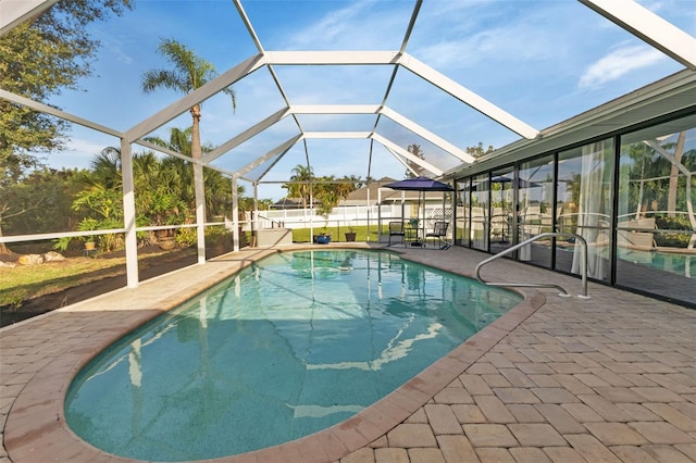 view of pool featuring a patio area and a lanai