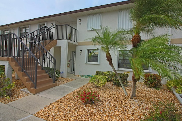 view of front of property with a balcony