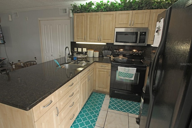 kitchen featuring a textured ceiling, black appliances, kitchen peninsula, sink, and light tile patterned flooring