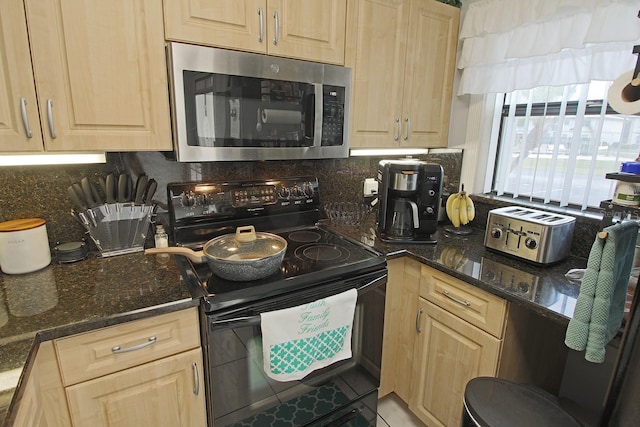 kitchen featuring tasteful backsplash, black range with electric stovetop, and light brown cabinets