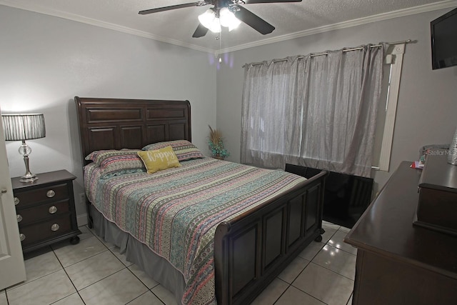 tiled bedroom featuring ceiling fan, ornamental molding, and a textured ceiling