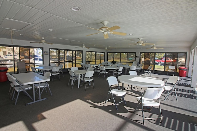 sunroom featuring ceiling fan