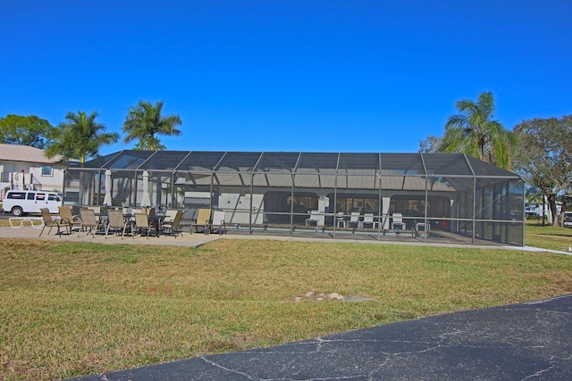 surrounding community featuring a lawn and a patio