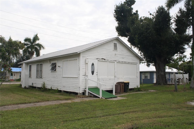 exterior space with a yard