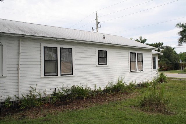 view of home's exterior featuring a yard