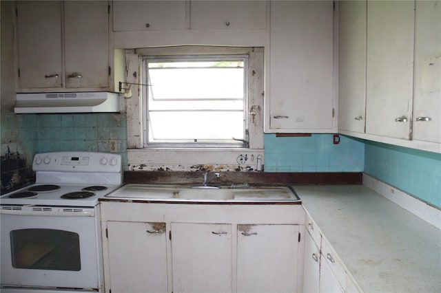 kitchen featuring white electric stove, backsplash, extractor fan, and white cabinets