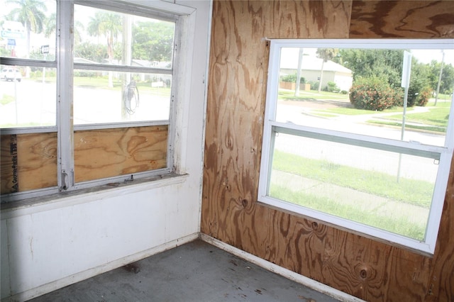 unfurnished room featuring plenty of natural light