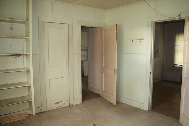 unfurnished bedroom featuring ornamental molding